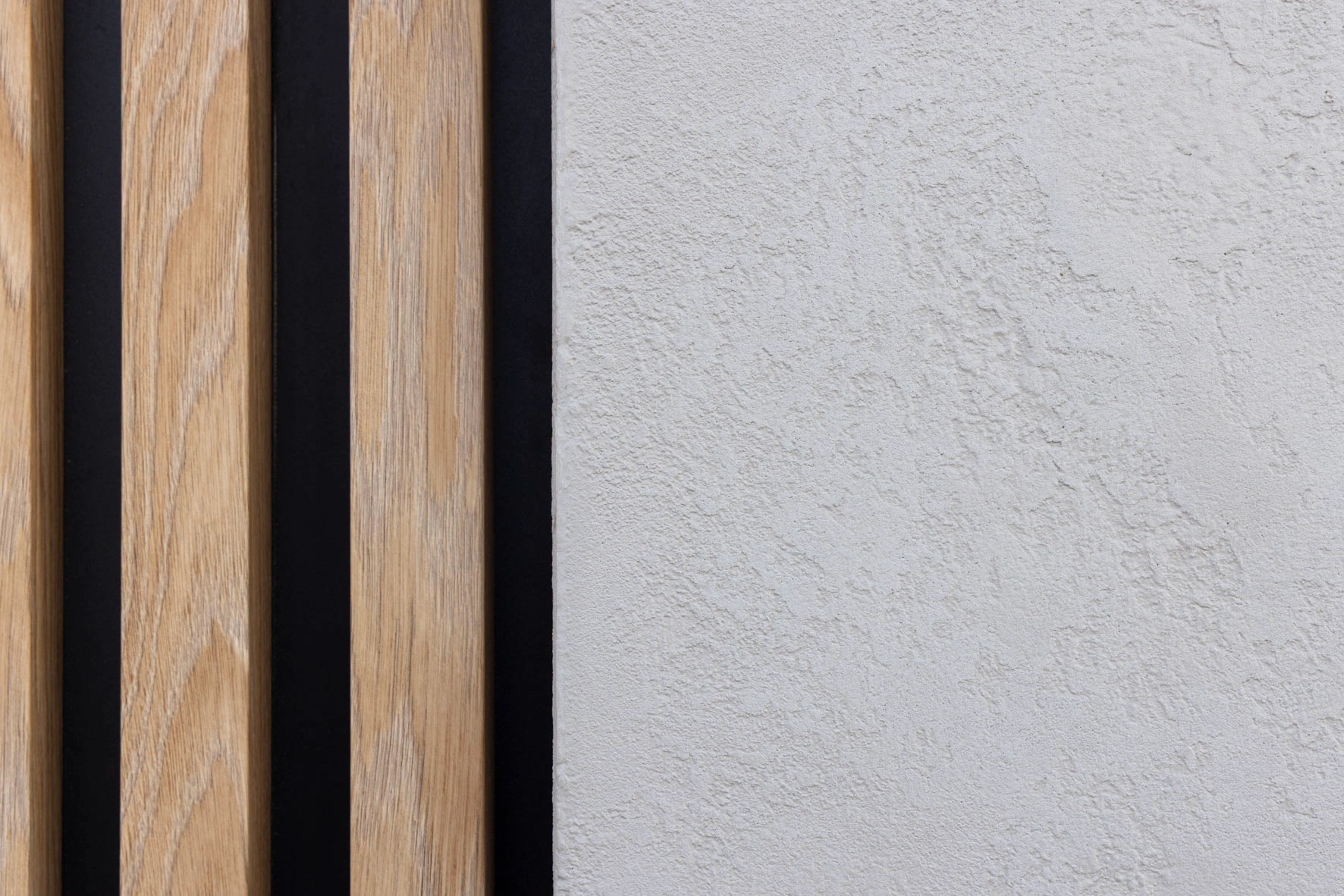Rijwoning Desselgem gevelisolatie textuur close-up naast hout